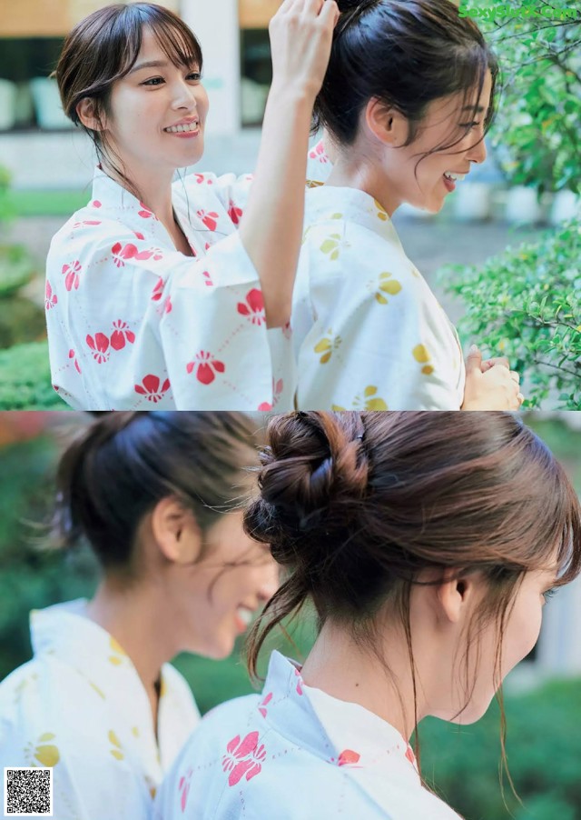 A woman in a white kimono with a messy bun in her hair.